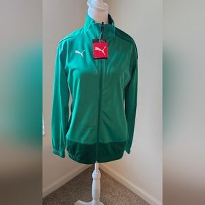 Women's green puma training jacket with elastic wrist and a white puma logo.